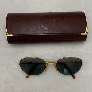 Cartier Gold half rim sunglasses with blue Sapphires and case.